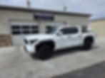 The white toyota tacoma received a 2 window match and 18in ppf