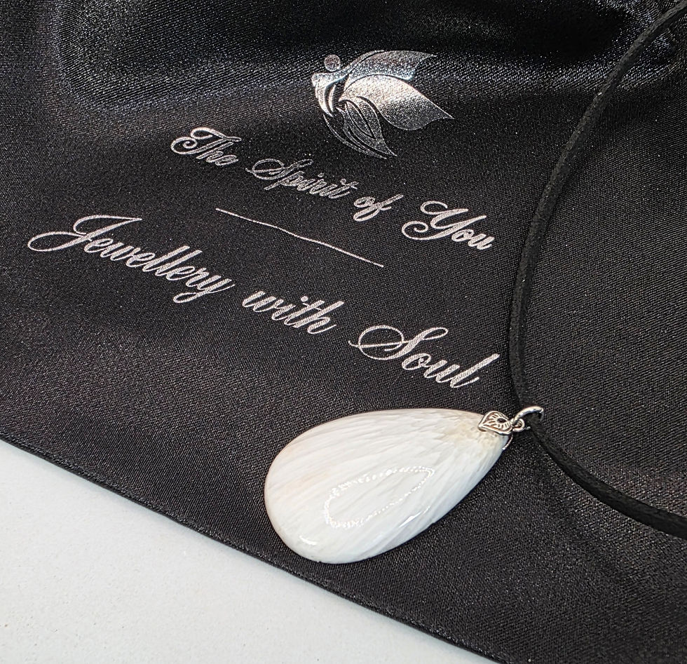 Thumbnail: White scolecite pendant on black cord, displayed on black satin pouch