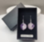 Charoite and sterling silver earrings displayed in a presentation box