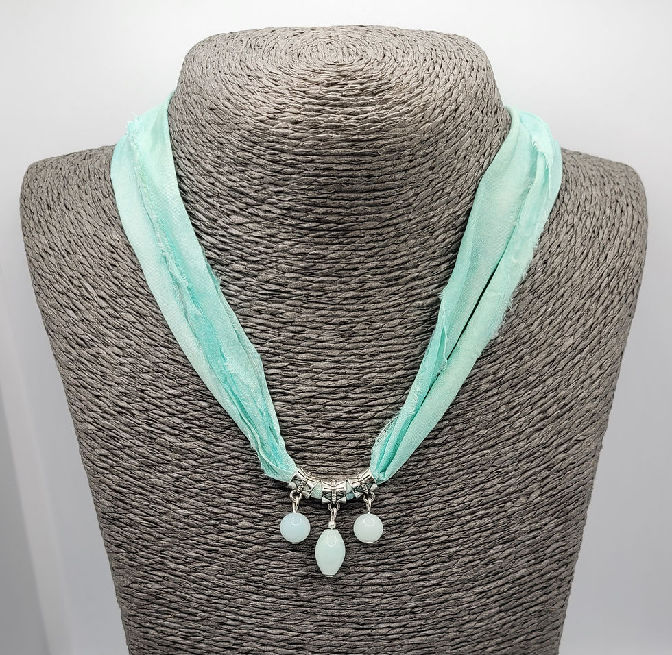 Thumbnail: Sari silk necklace with Amazonite beads, displayed on grey necklace bust