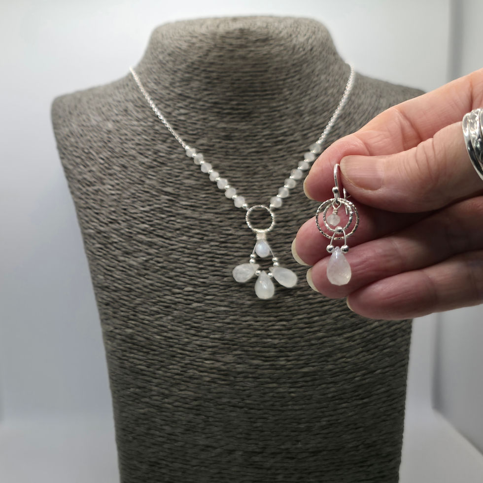 Thumbnail: Sterling silver and rainbow moonstone necklace displayed on necklace bust