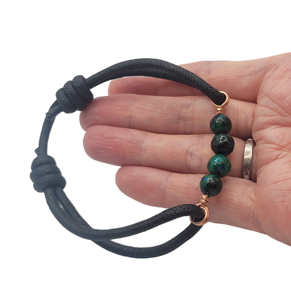 Thumbnail: Mens cord bracelet with 4 chrysocolla beads, displayed on hand