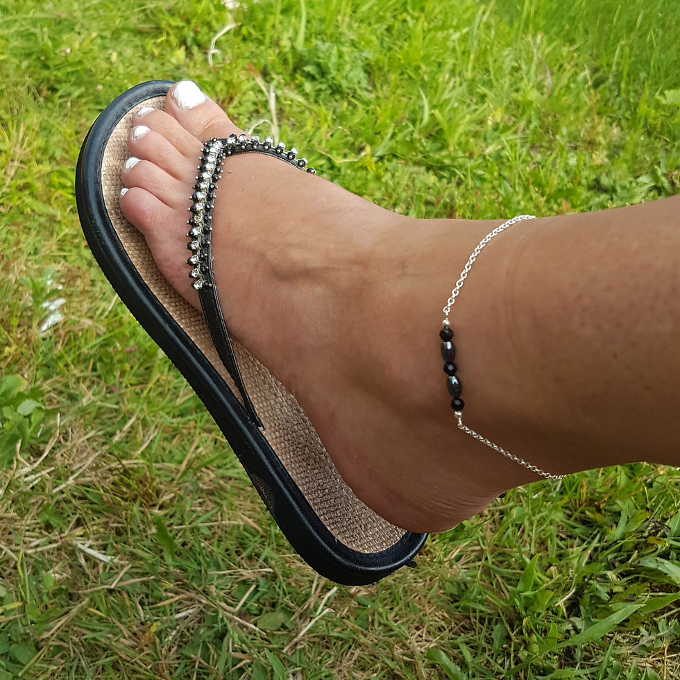 Black tourmaline, Hematite and sterling silver ankle bracelet, displayed on ankle