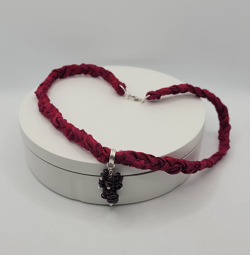 Thumbnail: Dark red plaited sari silk choker with garnet beads at the front.