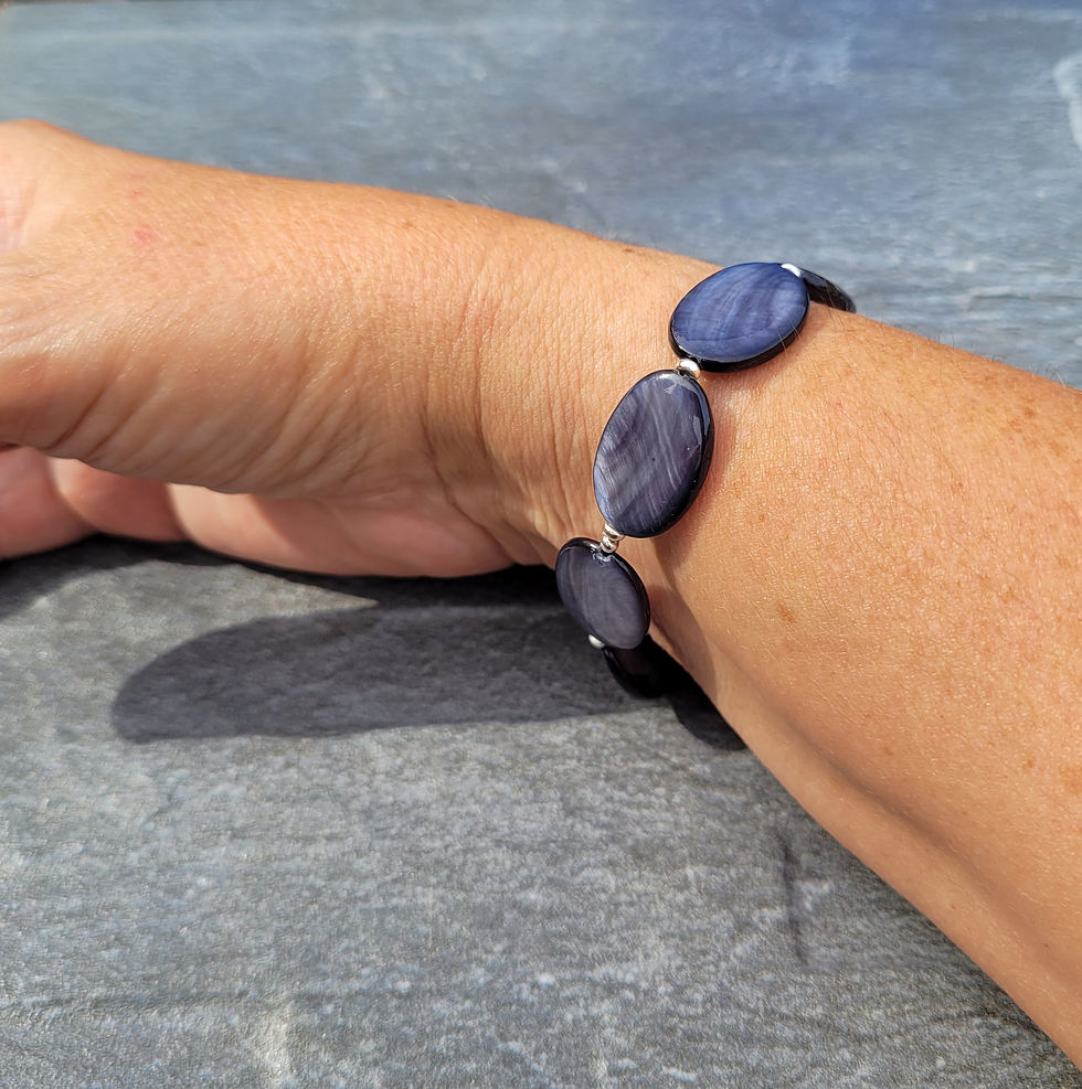 Thumbnail: Black Mother of Pearl stretchy bracelet displayed on wrist