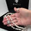 Thumbnail: Hand displaying double strand cultured pearl necklace with pearl and sterling silver front connector