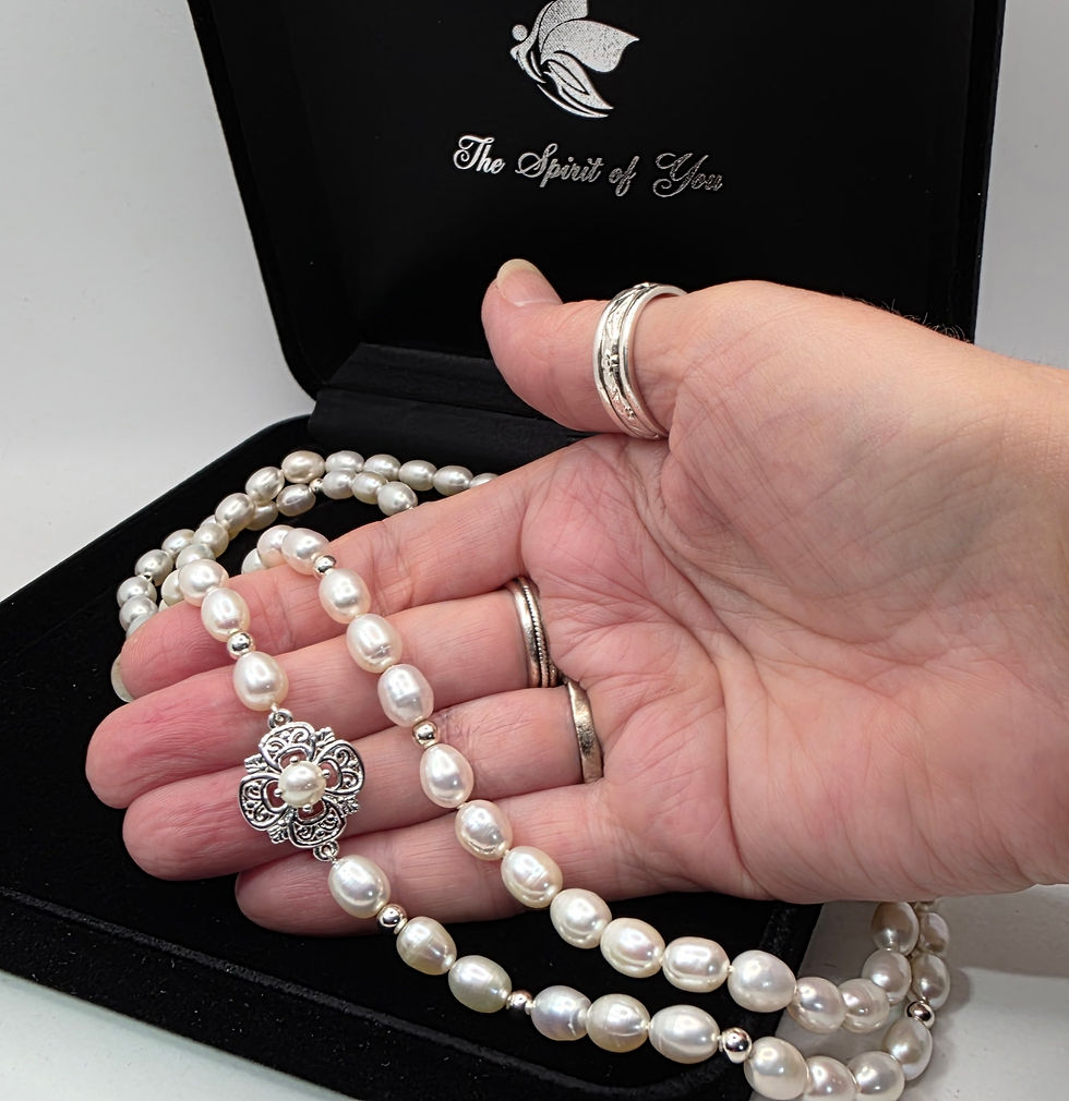 Thumbnail: Hand displaying double strand cultured pearl necklace with pearl and sterling silver front connector