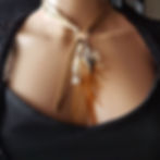 Sari silk and feather necklace, displayed on model