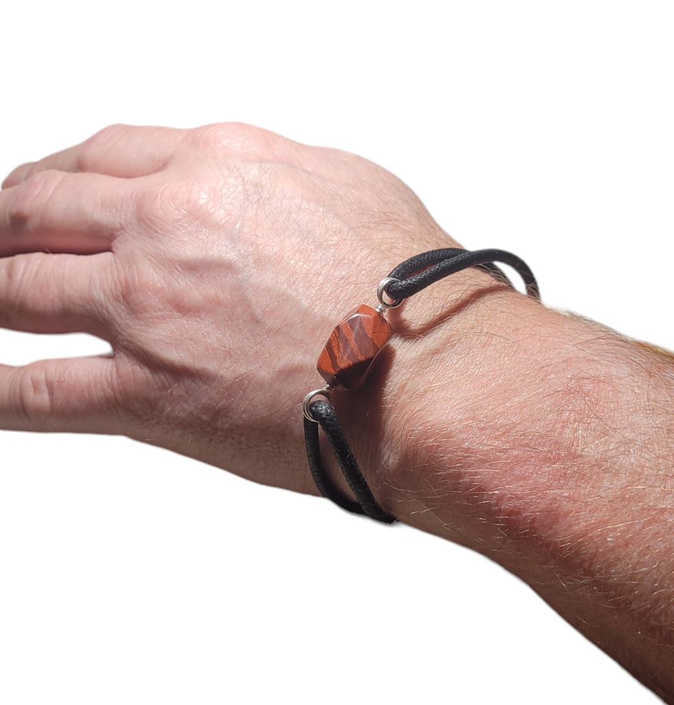 Thumbnail: Mens cord bracelet with large red jasper bead, displayed on wrist