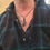 Thumbnail: Black cord necklace with Tektite, displayed on male model