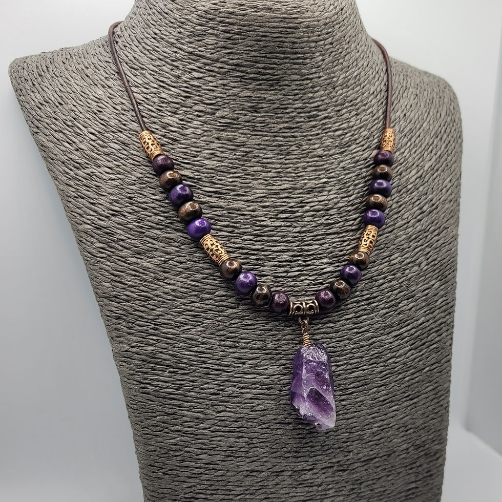 Wooden beaded amethyst necklace with large amethyst pendant on cord, displayed on grey necklace bust