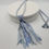 Thumbnail: Blue plaited sari silk necklace with tassel