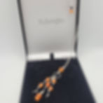 Carnelian and black spinel pendant on sterling silver chain, displayed in black presentation box