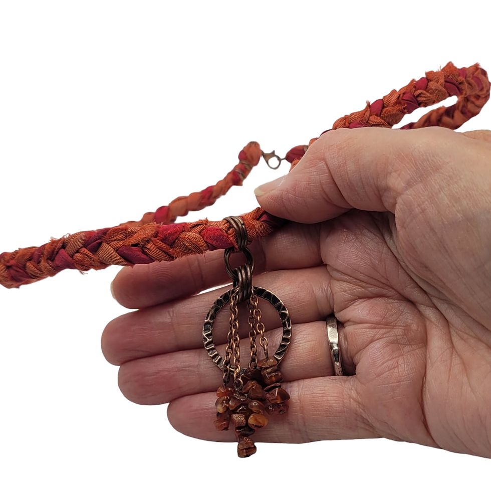 Thumbnail: Burnt orange plaited sari silk choker with fire opal beads at the front with antique copper.