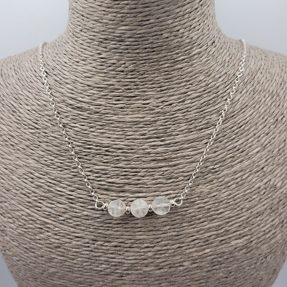 Thumbnail: Rainbow moonstone and sterling silver necklace, displayed on grey necklace bust