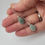 Thumbnail: Jade and sterling silver earrings in hand