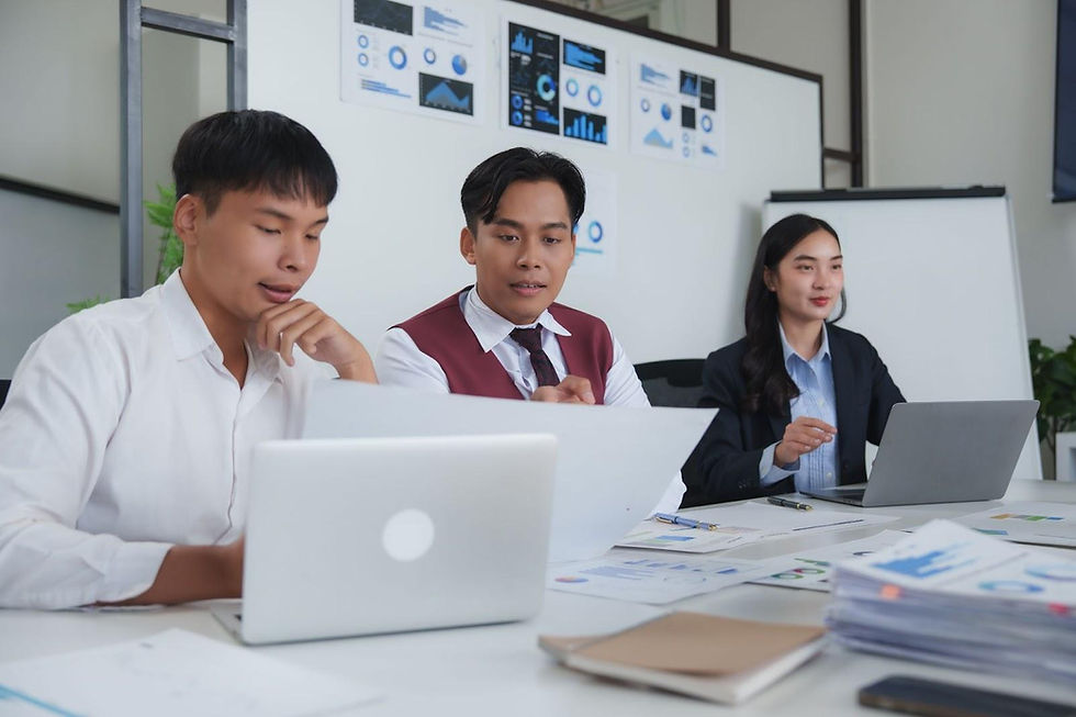 Evaluation specialists reviewing program data and dashboards to measure community violence intervention outcomes and ensure accuracy