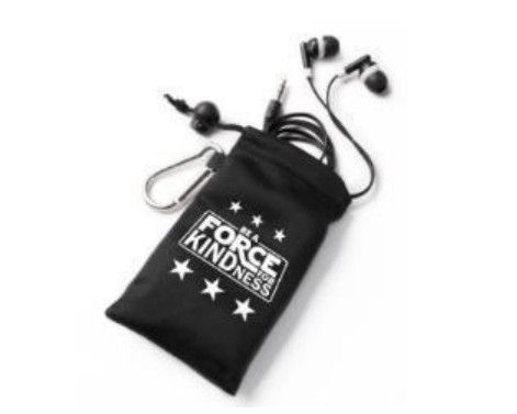 A black drawstring pouch with a carabiner clip, lying on a white surface. The pouch has "BE A FORCE FOR KINDNESS" printed in white letters with stars around it.