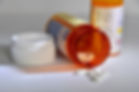 medications spilling out of container