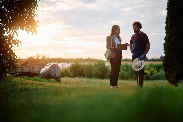 two people talking outdoors about land