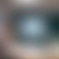 Business team collaborating around an interactive flat panel during a meeting in Connecticut