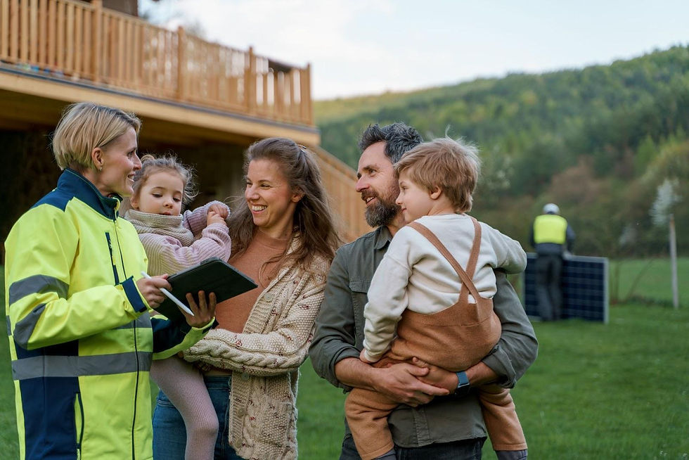 Family meeting with land agent outside new home