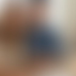  smiling Hispanic couple reviewing land loan documents together from an RGV loan servicing provider