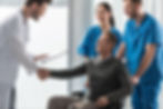 doctor and patient handshake in clinic trust healthcare partnership