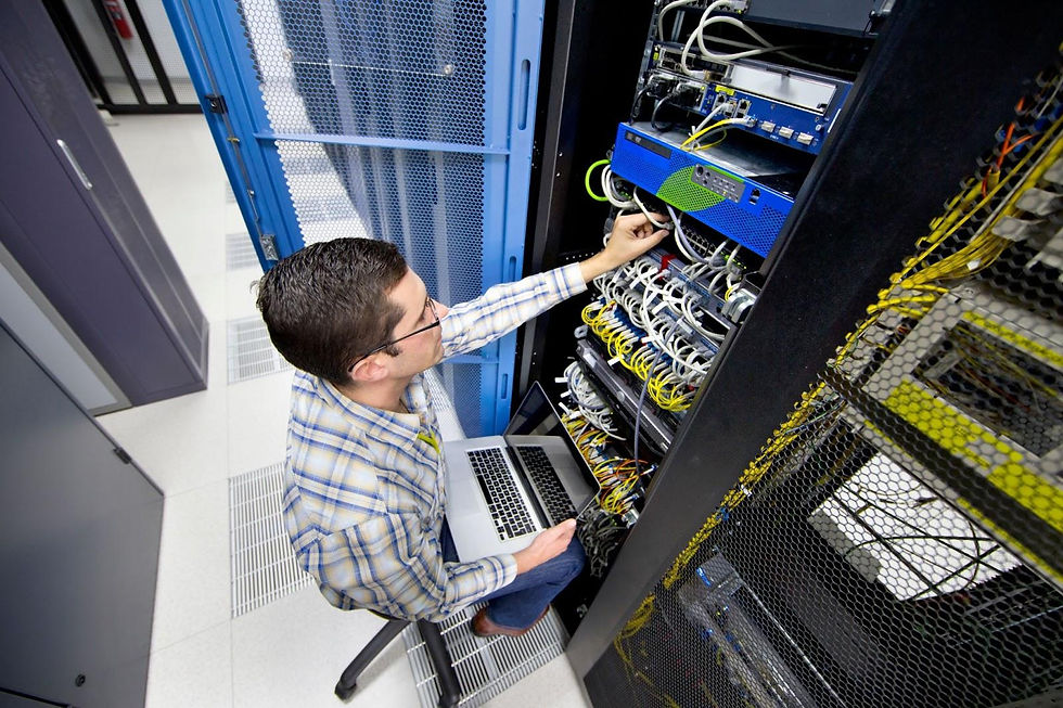 IT staff configuring network settings and device management for school technology.