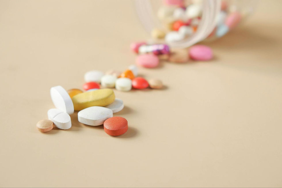 assorted medications spilling out of container