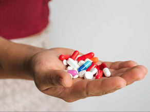 person holding assorted medications, illustrating the curiosity to know how long are prescriptions good for