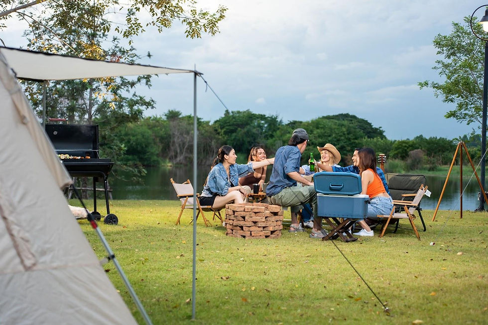 Outdoor seating and cooking setup on Texas land with shade canopy and camp chairs for a simple, comfortable getaway.