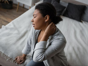 woman holding neck while suffering from neck pain, needing effective chronic pain management