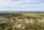 aerial view of land with some houses