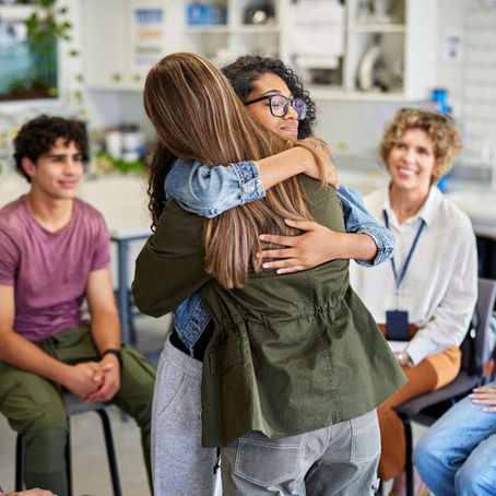 Mentors and counselors guiding young people through structured rehabilitation and personal growth activities in a supportive environment