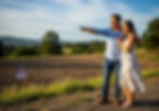 Couple viewing Texas acreage through new buyer home loan owner financing, a path to affordable land ownership without bank barriers.