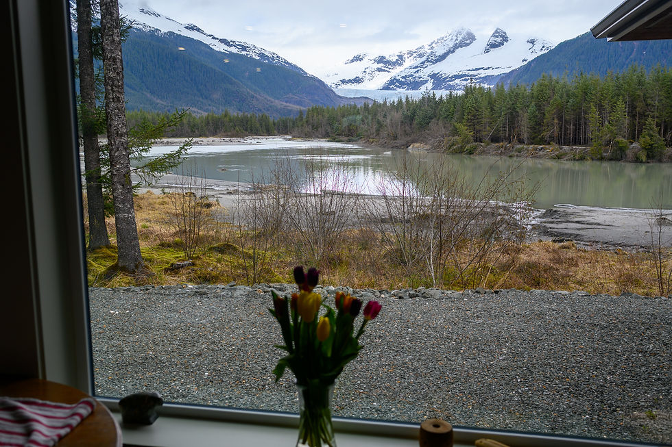 The Mendenhall Glacier is seen in the distance above the Mendenhall River from Kim Peterson’s View Drive home on Saturday, May 16, 2026. (Jasz Garrett / Juneau Independent)