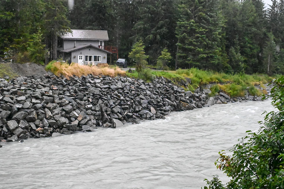 A residence on View Drive is seen above the Mendenhall River on Friday, Aug. 8, 2025. (Jasz Garrett / Juneau Independent)