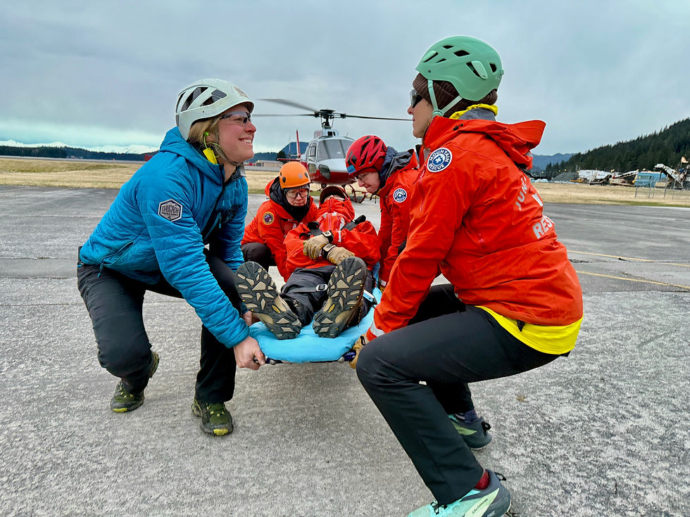 Juneau Mountain Rescue volunteers practice carrying a subject from a helicopter. (Photo courtesy of Juneau Mountain Rescue)