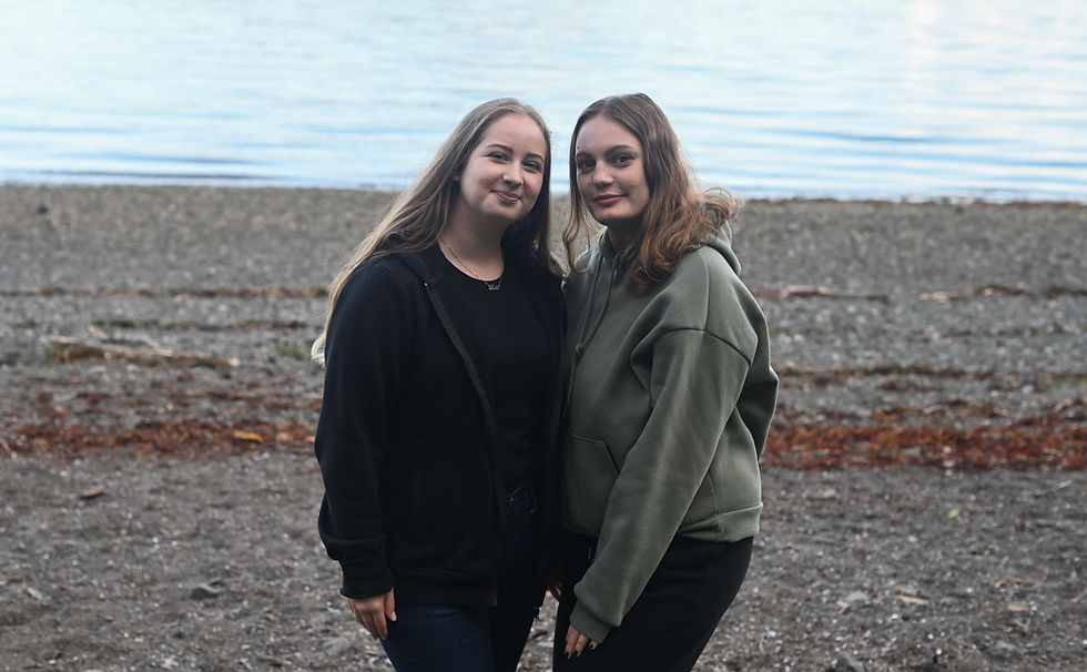 Kateryna and Alla, who grew up together in Uman, Ukraine, stand together at Auke Recreation Area on Monday, Aug. 18, 2025. (Jasz Garrett / Juneau Independent)