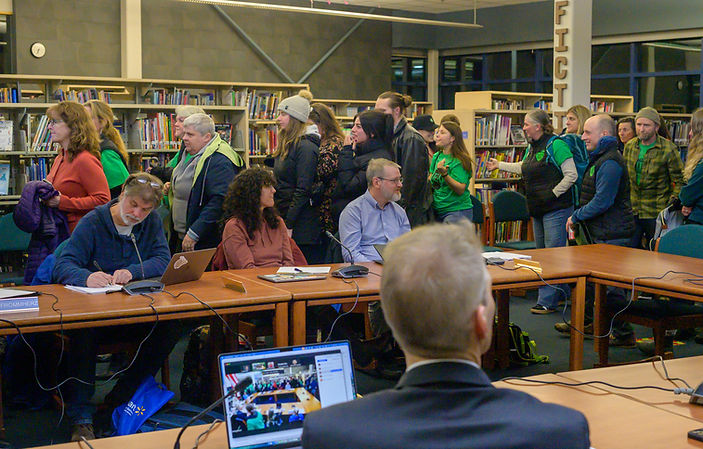 Juneau School District Superintendent Frank Hauser watches as educators walk out during a Juneau Board of Education meeting on Tuesday, Nov. 18, 2025. (Jasz Garrett / Juneau Independent)