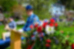 Alaska Wildlife Trooper Sgt. Branden Forst reads the name of fallen officers while Department of Corrections probation officer Kelly Sweny tolls a memorial bell at Evergreen Cemetery on Friday, May 15, 2026. (Jasz Garrett / Juneau Independent)