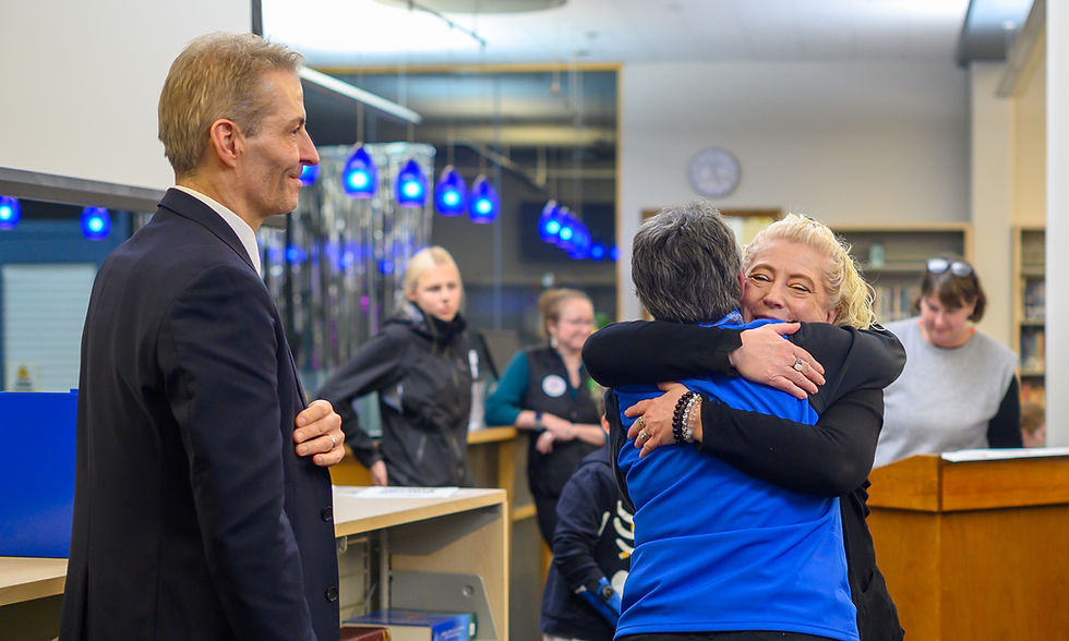 New Juneau Board of Education president Britteny Cioni-Haywood hugs Deedie Sorensen on Tuesday, Oct. 28, 2025. (Jasz Garrett / Juneau Independent)
