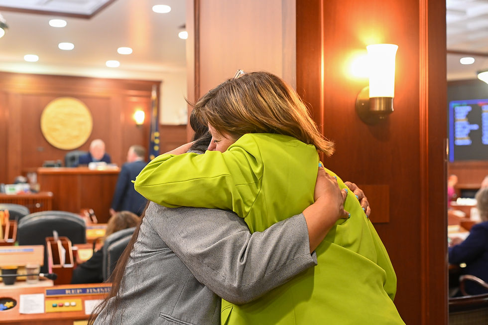 Rep. Alyse Galvin, I-Anchorage, hugs Rep. Nellie Unangiq Jimmie, D-Toksook Bay, embrace on the opening day of the special legislative session on Saturday, Aug. 2, 2025. (Jasz Garrett / Juneau Independent)