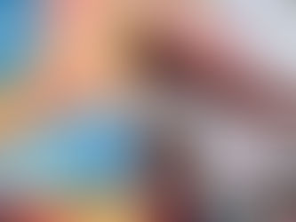 Julie standing in a window looking hopefully at the sky