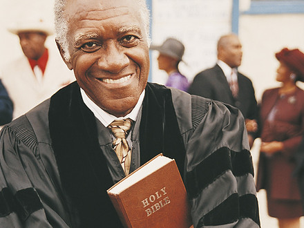 Smiling Man Holding Bible