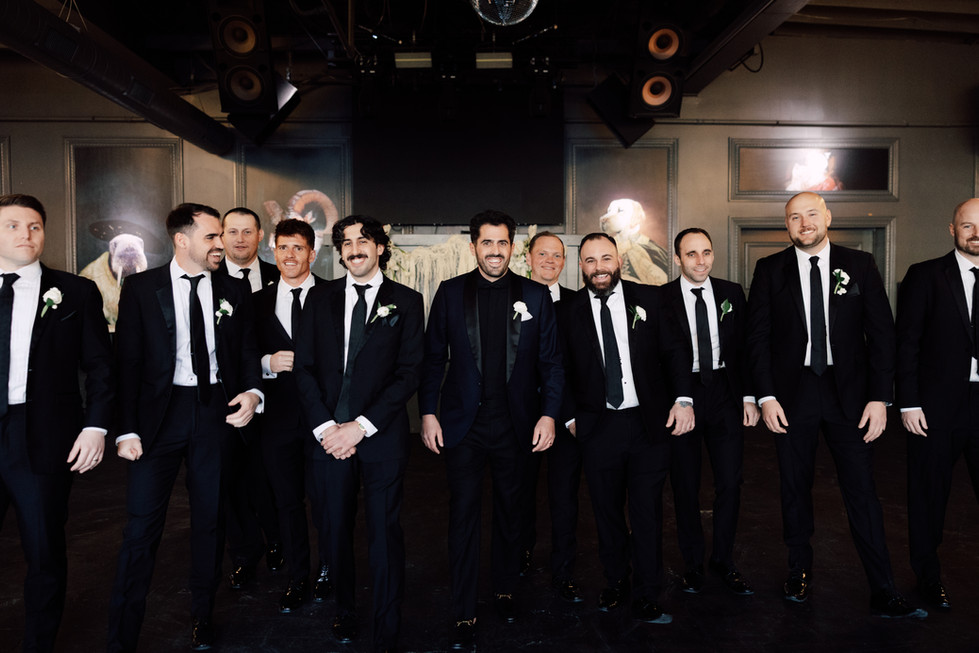 Groomsmen posing with Groom. 