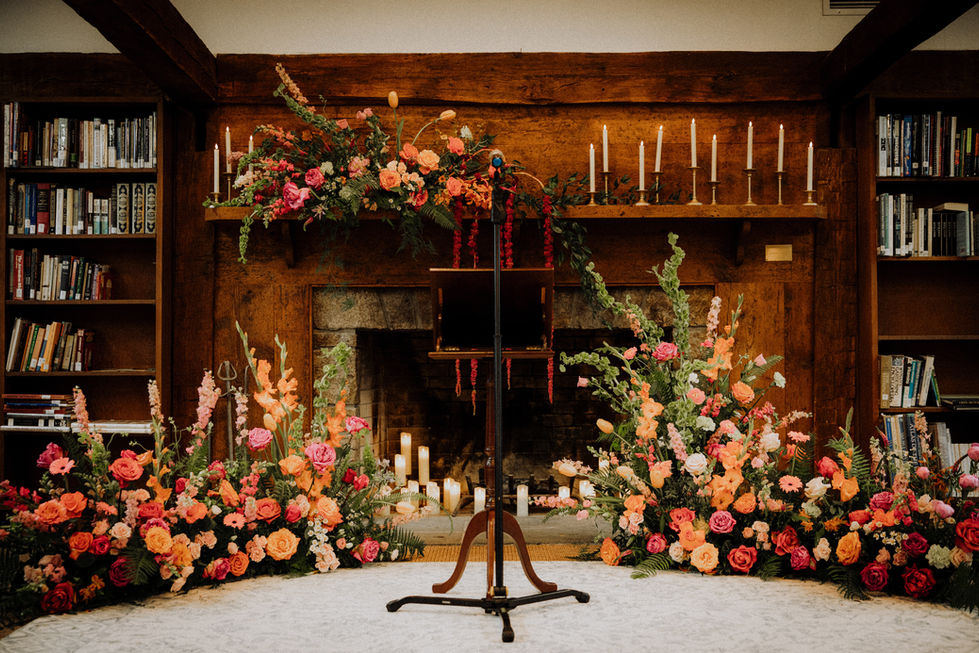 Floral arrangement with candles in a rustic setting.