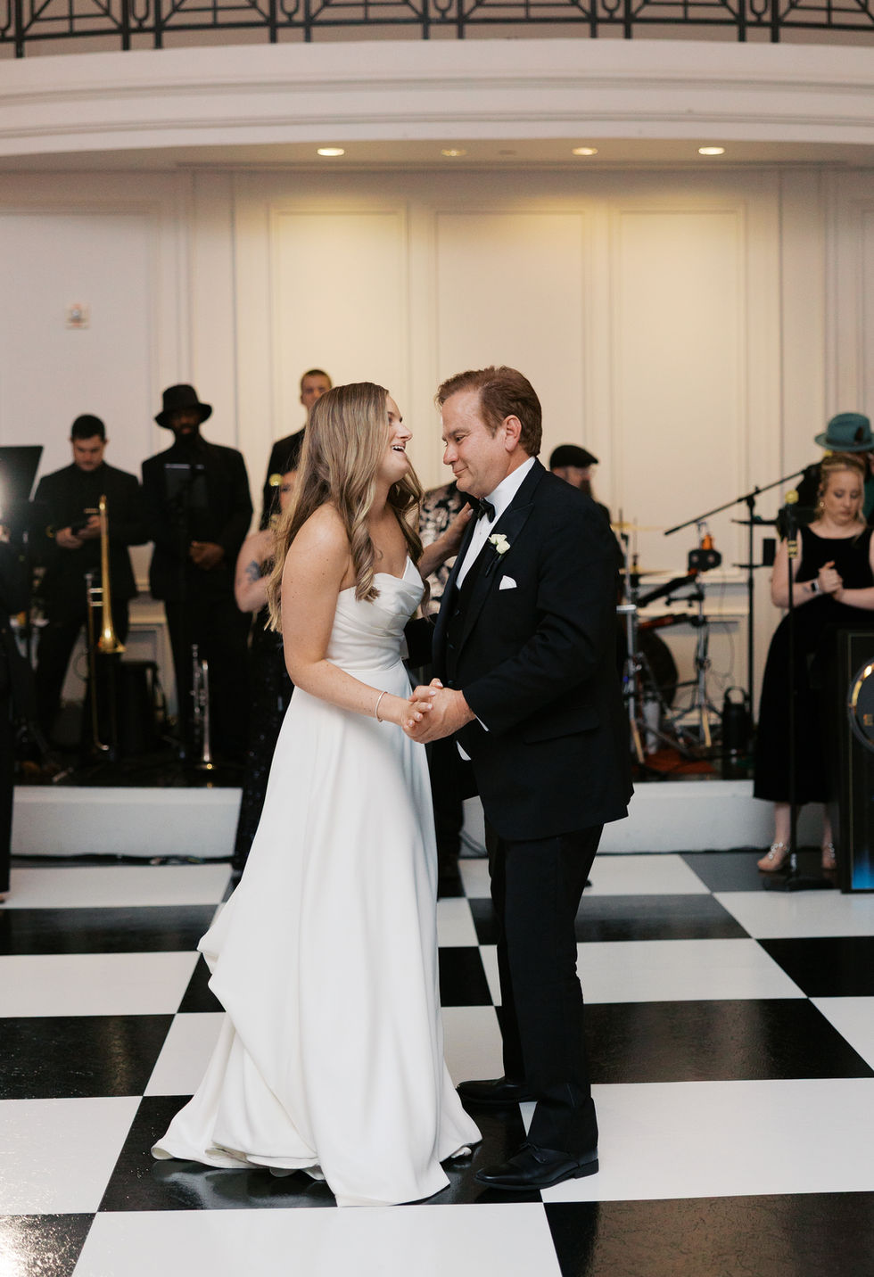 Bride and father dancing at a wedding reception.