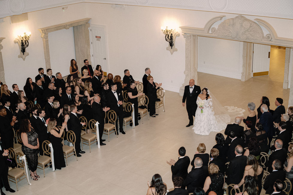 Bride walking down the ceremony aisle. 